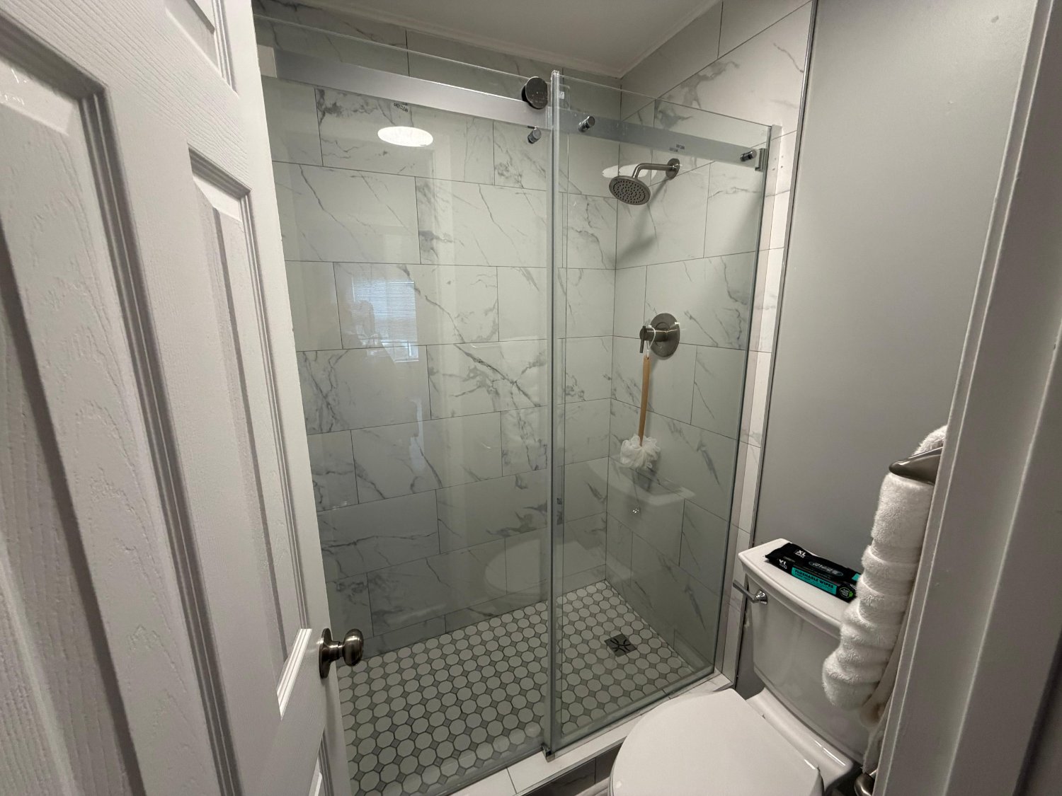 Glass shower enclosure